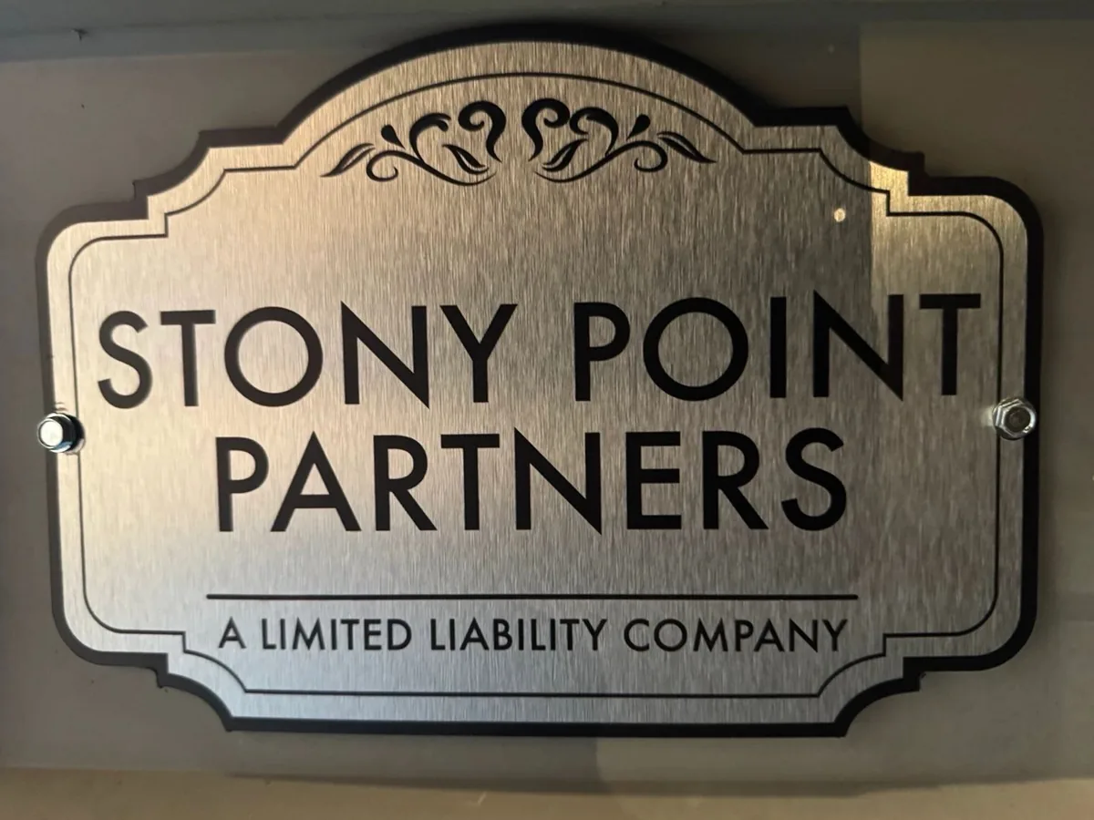 Brushed-metal office sign reading Stony Point Partners, A Limited Liability Company